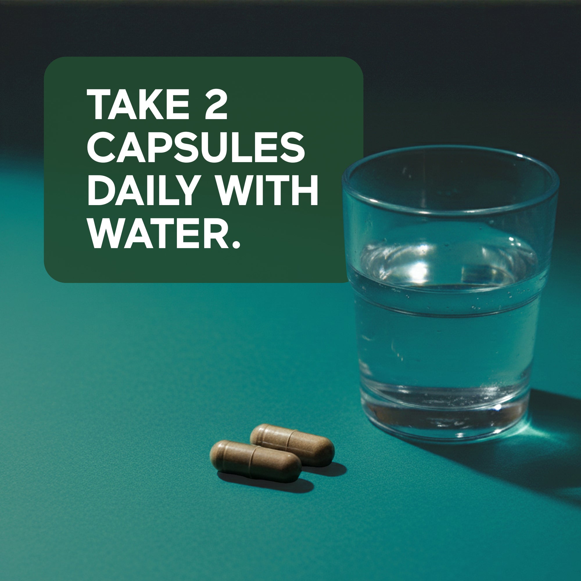 Two sea moss capsules and a glass of water on a teal background with text 'Take 2 capsules daily with water'.