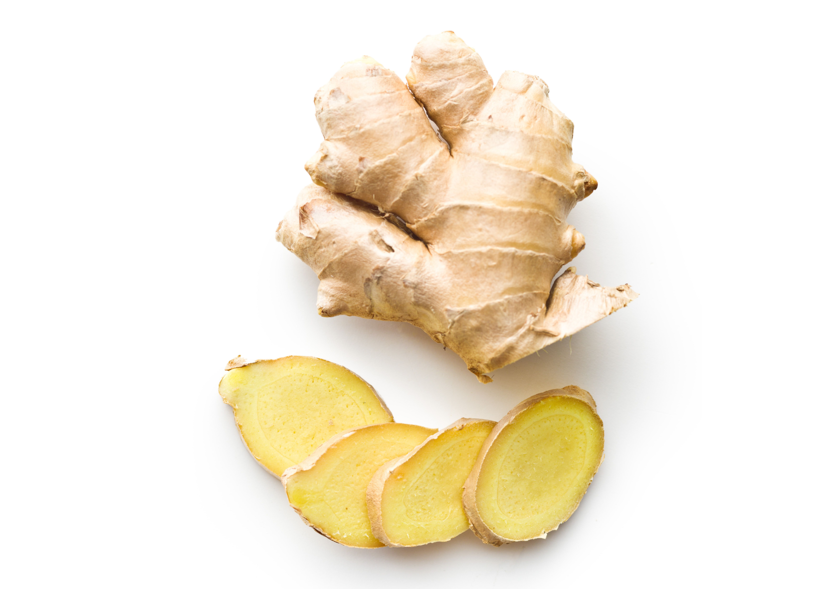 Ginger root sliced on a white background.