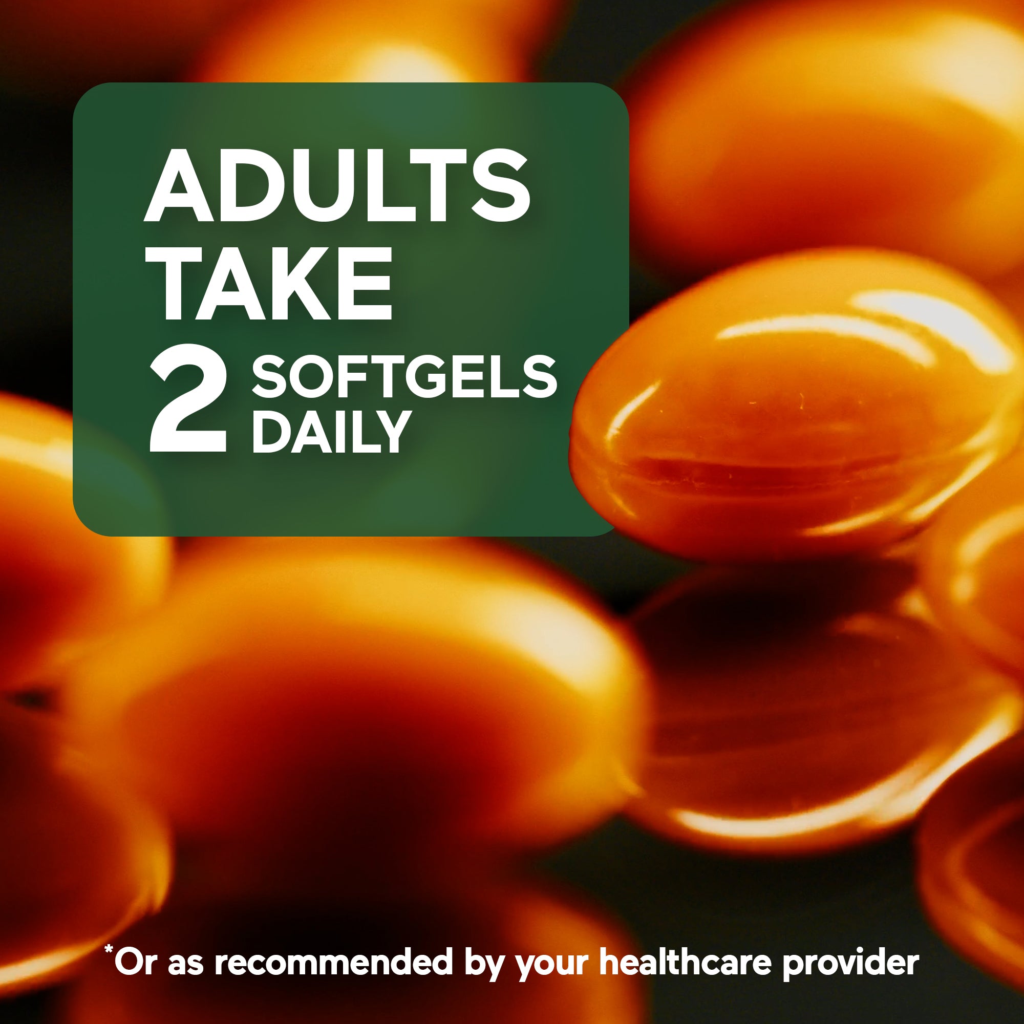 Close-up of orange softgels with text overlay on a dark background