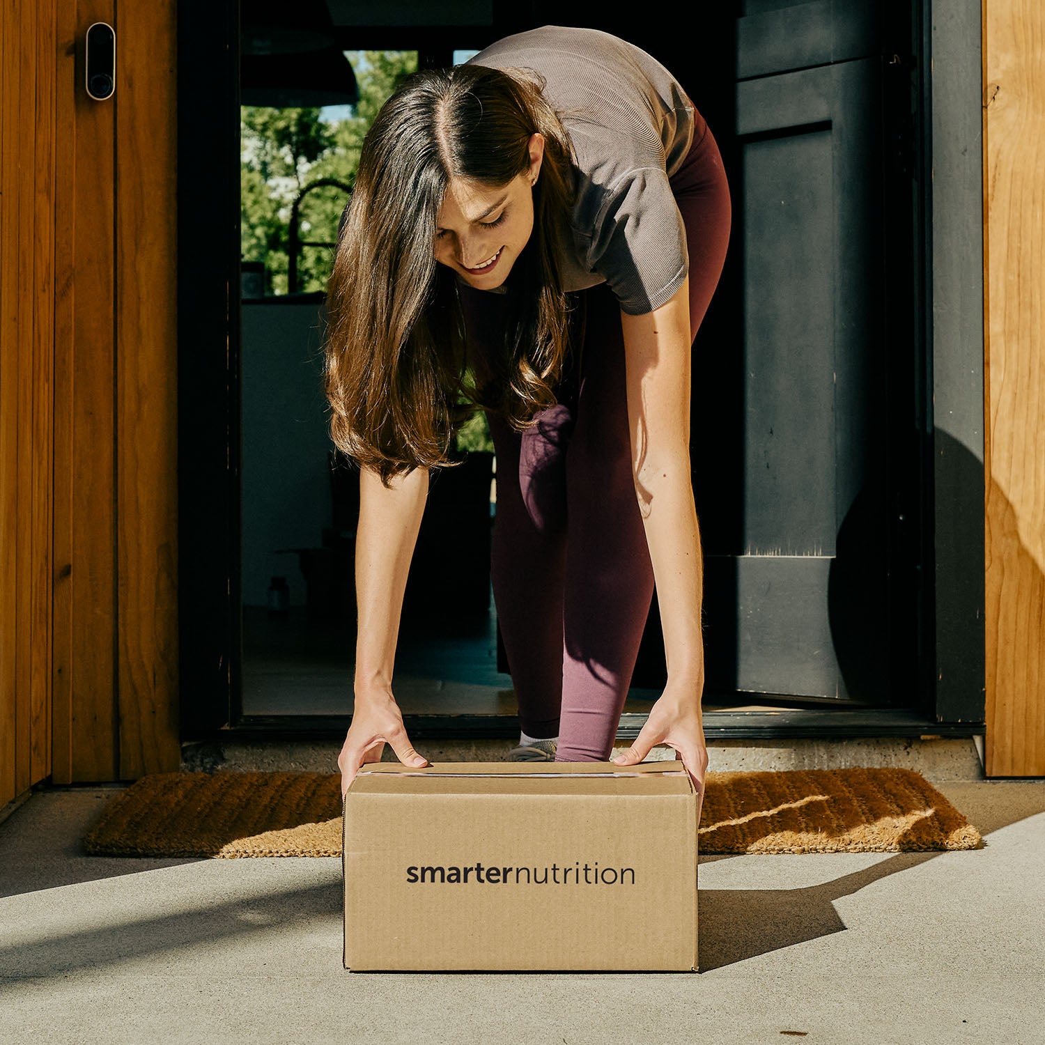 Girl reaching for a Smarter Nutrition package